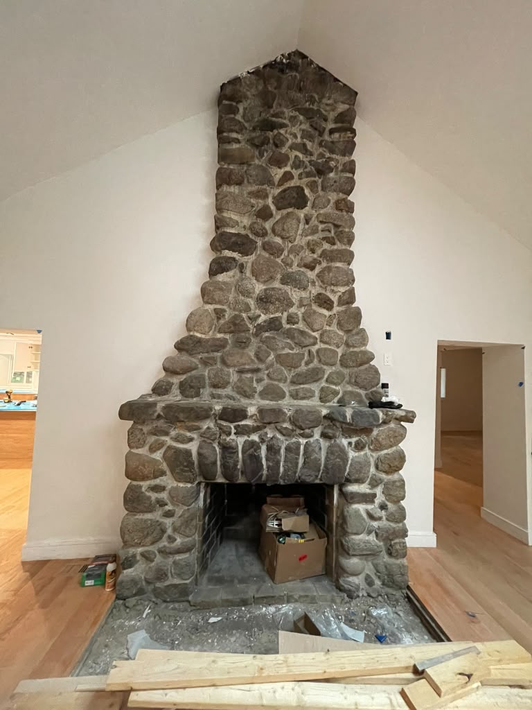 Fireplace remodel — custom mantel & paneled chimney — before remodeling